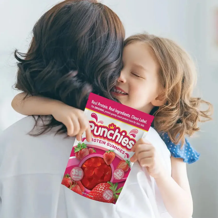 Kids protein supplement: a parent hugging a child with a bag of Punchies protein gummies
